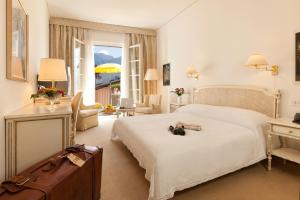 Ліжко або ліжка в номері Hotel Tamaro
