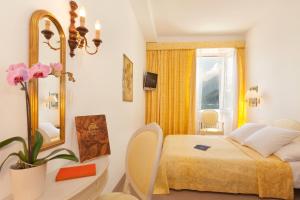Ліжко або ліжка в номері Hotel Tamaro