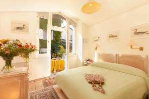 Ліжко або ліжка в номері Hotel Tamaro