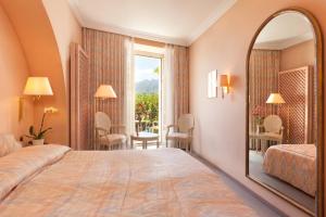 Ліжко або ліжка в номері Hotel Tamaro