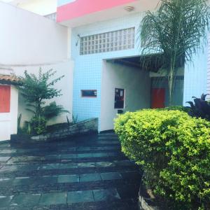 a building with a walkway in front of it at Hotel City I in Santo André