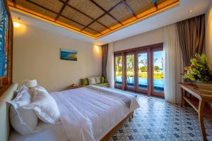 Postel nebo postele na pokoji v ubytování Sao Mai Beach Resort + 37 fotografií