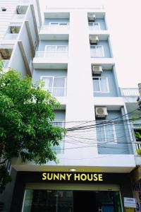 a building with a suny house in front of it at Sunny House in Da Nang