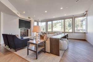 a living room with a couch and a table at Premium Three Bedroom in Park City