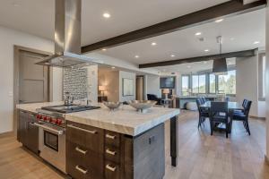 a kitchen with a counter top and a dining room at Premium Three Bedroom in Park City