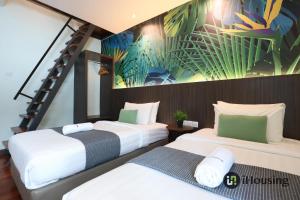 Postel nebo postele na pokoji v ubytování Trevor Hotel Malacca Town By I Housing