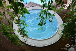 Der Swimmingpool an oder in der Nähe von Schmolti's Chalet - Wellness über Graz