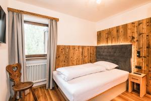 Posteľ alebo postele v izbe v ubytovaní Chalet Scherlin