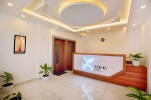 an office lobby with a large screen in the middle at Zenha Resorts in Munnar