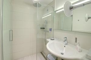 Bilik mandi di Hotel Wechselberger by Alpeffect Hotels
