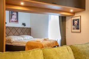 Postel nebo postele na pokoji v ubytování Borkapartman