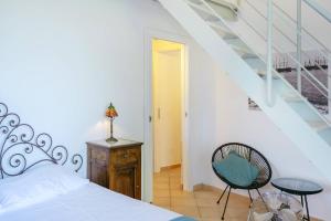 A bed or beds in a room at Palazzo Attila - Gioia Apartments