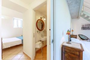 A bed or beds in a room at Palazzo Attila - Gioia Apartments