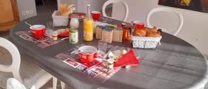 a table with food and drinks on top of it at Chez Carole et Michel en Minervois in Rieux-Minervois