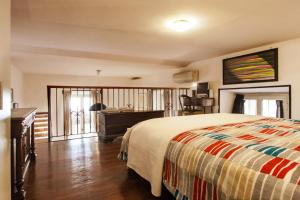 a bedroom with a bed and a desk and a window at Ninohouse in Rome