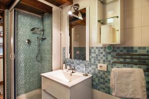 a bathroom with a sink and a shower at Ninohouse in Rome