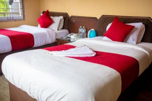 Postelja oz. postelje v sobi nastanitve Hotel Yatri