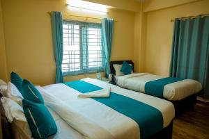 Postelja oz. postelje v sobi nastanitve Hotel Yatri