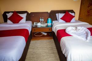 Postelja oz. postelje v sobi nastanitve Hotel Yatri