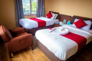 Postelja oz. postelje v sobi nastanitve Hotel Yatri