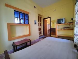 Postel nebo postele na pokoji v ubytování Monalisa Lodge
