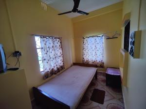Postel nebo postele na pokoji v ubytování Monalisa Lodge