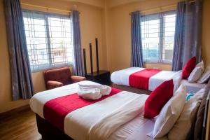 Postelja oz. postelje v sobi nastanitve Hotel Yatri