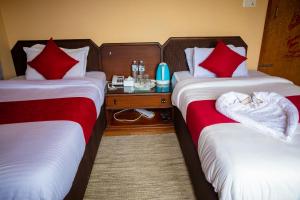 Postelja oz. postelje v sobi nastanitve Hotel Yatri