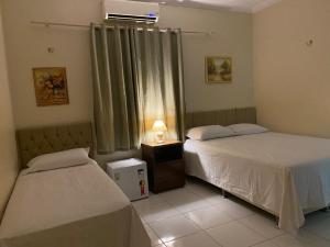 Postel nebo postele na pokoji v ubytování Bertolini Hotel