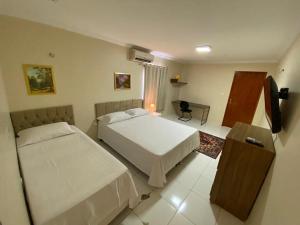 Postel nebo postele na pokoji v ubytování Bertolini Hotel
