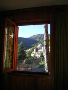 a window with a view of a mountain view at Residence I Comignoli in Scanno