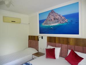 Cama ou camas em um quarto em Arikanda River Garden Hotel