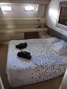 a bed with two binoculars sitting on top of it at Un yacht de 24m rien que pour vous ! in Sète