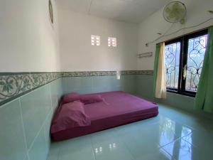 Postel nebo postele na pokoji v ubytování Grapyak Homestay Syariah