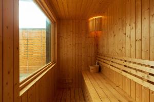 a room with a sauna with a window at Grand Gala Villa in Pattaya South