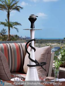a candle holder sitting on top of a table at Grand Cosmopolitan Hotel in Dubai