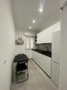 A kitchen or kitchenette at Mamuccia Rooms