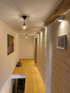 a hallway of a house with a wooden wall at Ferienhaus Klause in Neureichenau