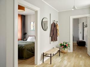 Säng eller sängar i ett rum på Rosenborg Hotel Apartments