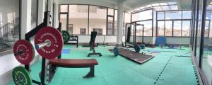 a room with a gym with a swimming pool at Dalat Family Hostel in Da Lat