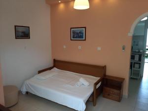 Ένα ή περισσότερα κρεβάτια σε δωμάτιο στο Apartment in Mpenitses near Beaches & Pool