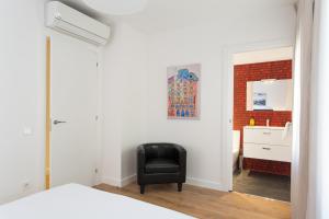 Postel nebo postele na pokoji v ubytování Key San Pau House Terrace - Barcelona