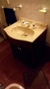 a bathroom with a sink and a toilet at Residencia "Libertad" in San Andrés