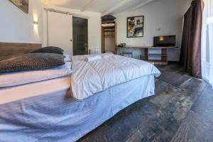 מיטה או מיטות בחדר ב-La Jalousie