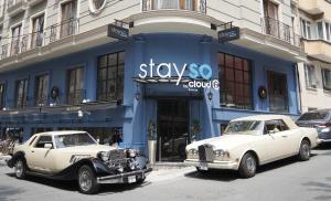 two old cars parked in front of a store at Stayso by Cloud7 Hotels in Istanbul