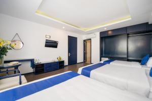 Postel nebo postele na pokoji v ubytování Alibaba Hotel by THG