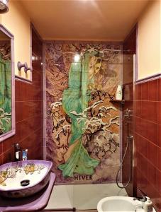 a bathroom with a sink and a mural of a mermaid at B&B Les Saisons de Jade in Nocera Superiore +53 photos