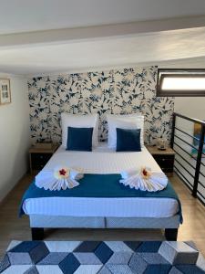 Postel nebo postele na pokoji v ubytování BUNGALOW LE COROSSOL