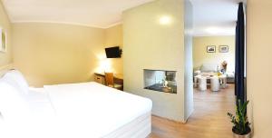Postel nebo postele na pokoji v ubytování Wellness Hotel Bozeňov