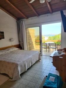 Postel nebo postele na pokoji v ubytování Hotel Olimpia